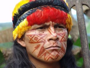 Portrait of Shuar Indian in Ecuador’s Amazon, where gross violations of human and environmental rights have been committed by oil companies. Photo: hartman via Flickr (CC BY-NC-SA).